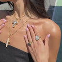 The Tethys Baroque Pearl Cross with Roman Chain